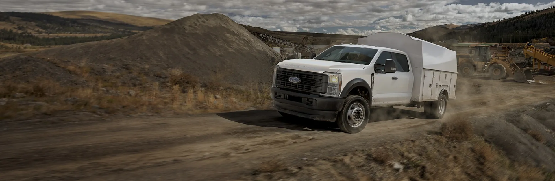 Ford Super Duty truck towing on a dirt work site