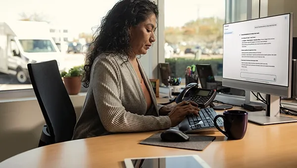 Commercial sales consultant working at her desk